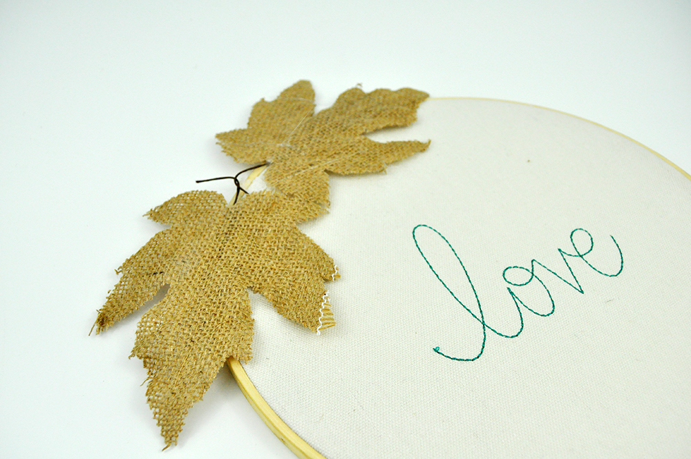Love Embroidery Hoop Tutorial with burlap leaves, and die cut flowers and leaves. Designed by Jen Gallacher. 15 Minute Craft: Embroidery Hoop Decoration.