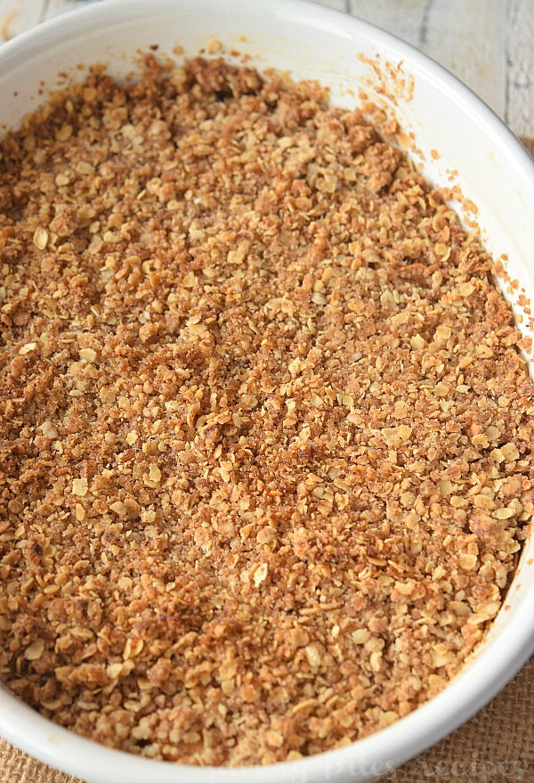 a white baking dish with old fashioned apple crisp