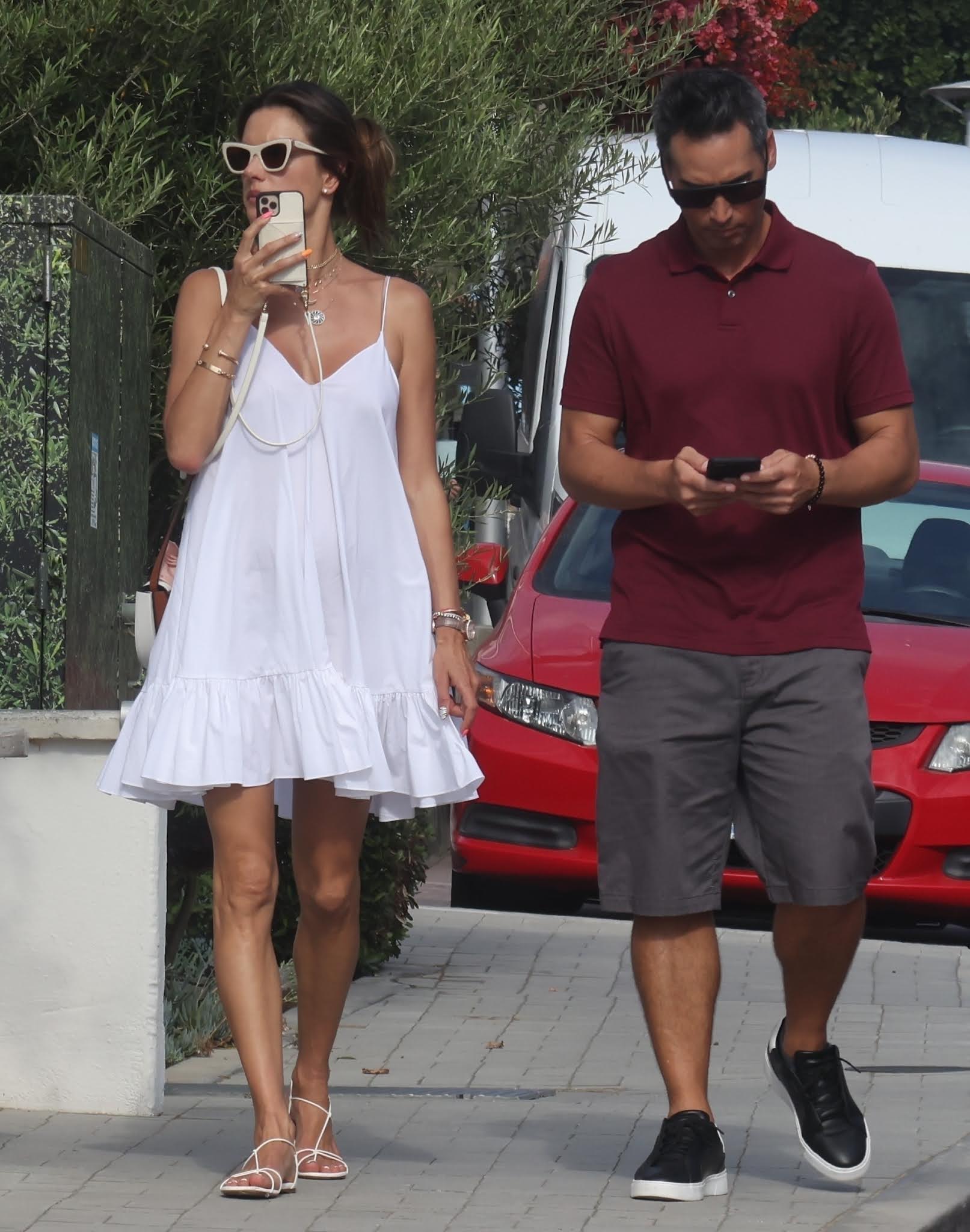 Alessandra Ambrosio in a white Summer dress while out with her boyfriend in Malibu