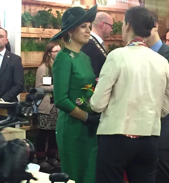 2018 Dutch Organic Trade Fair at IJsselhallen Convention Center in Zwolle. Queen Maxima wore Natan dress and Natan shoes, green diamond earrings