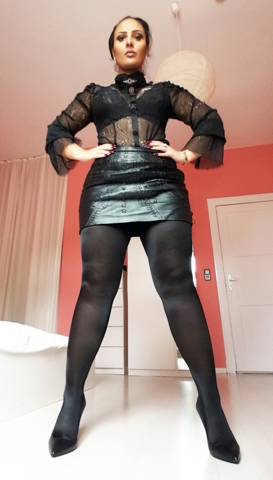 Strict Mistress in black pantyhose and high heels