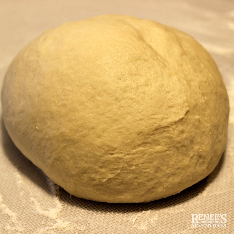 Overhead image of dough, kneaded and formed into a ball, resting for Apple Cinnamon Rolls with Maple Frosting by Renee's Kitchen Adventures