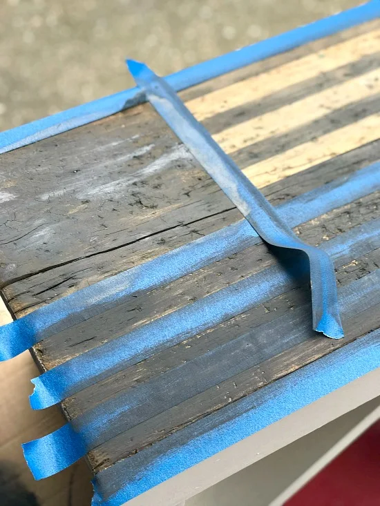 Taping off an American flag with painter's tape