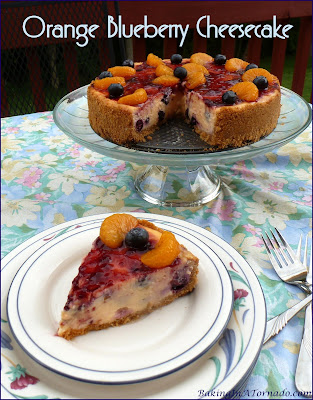 Orange Blueberry Cheesecake, bursting with orange flavor and studded with fresh blueberries. | Recipe developed by www.BakingInATornado.com | #recipe #dessert