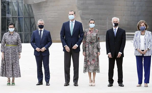 Queen Letizia wore a floral print midi dress from Zara, and canvas espadrille wedges by Macarena, Queen wore a gold earrings