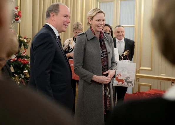 Princess Charlene wore Louis Vuitton wool coat. Rosine Sanmori Nursery / Day Care Centre in Fontvieille. Christmas gifts