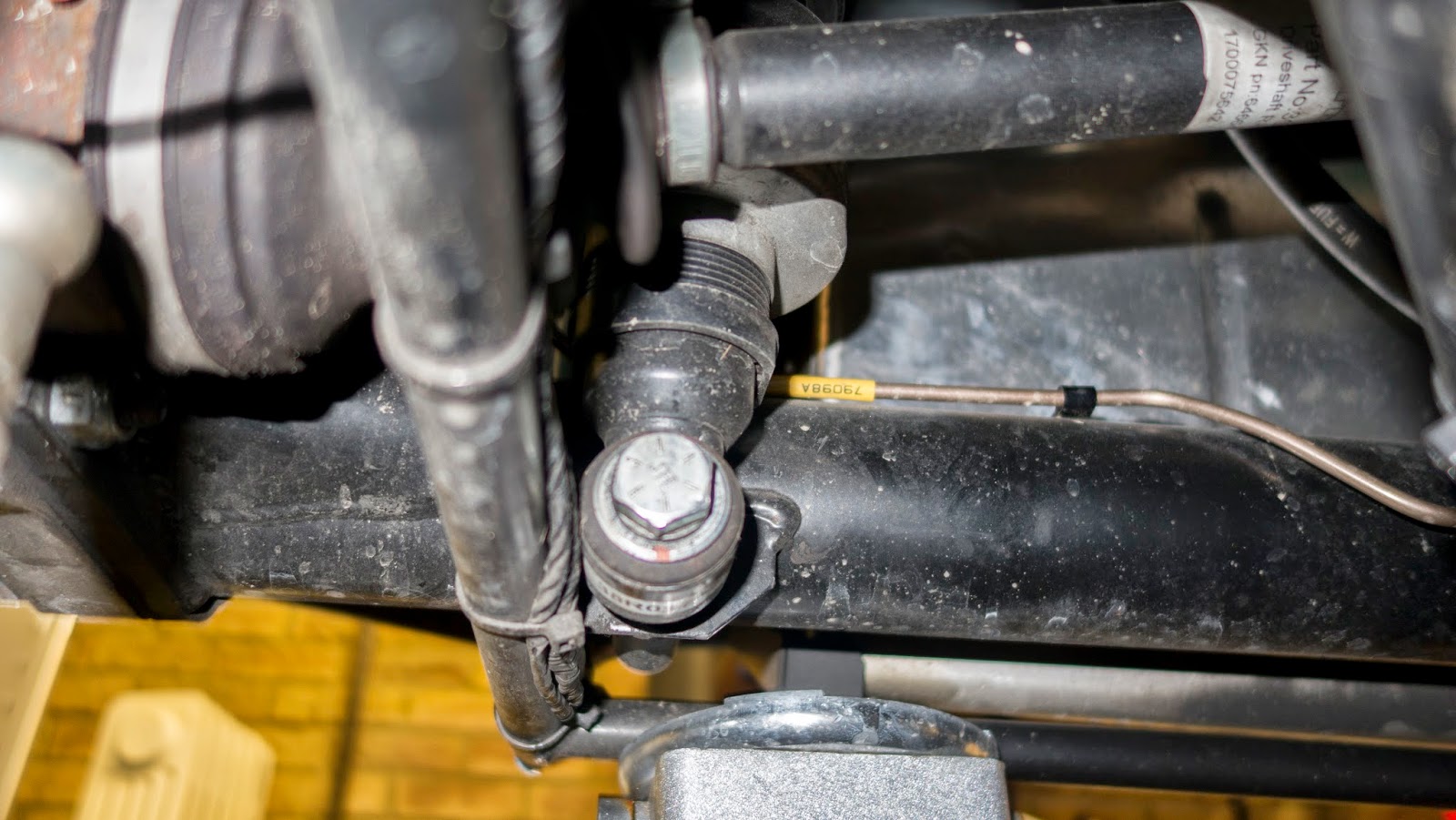 Use a 19mm socket to remove the lower suspension mounting bolt