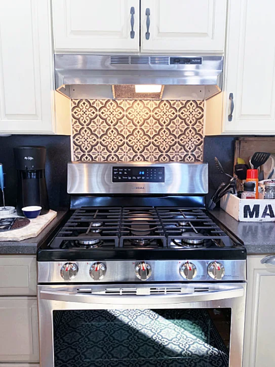 stove with tiled wall after photo