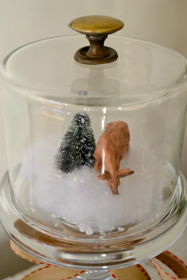 winter scene snow globes on DIY candle stick pedestals www.homeroad.net