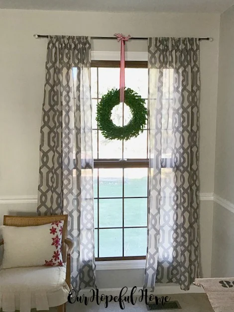 boxwood wreath hanging window drapes