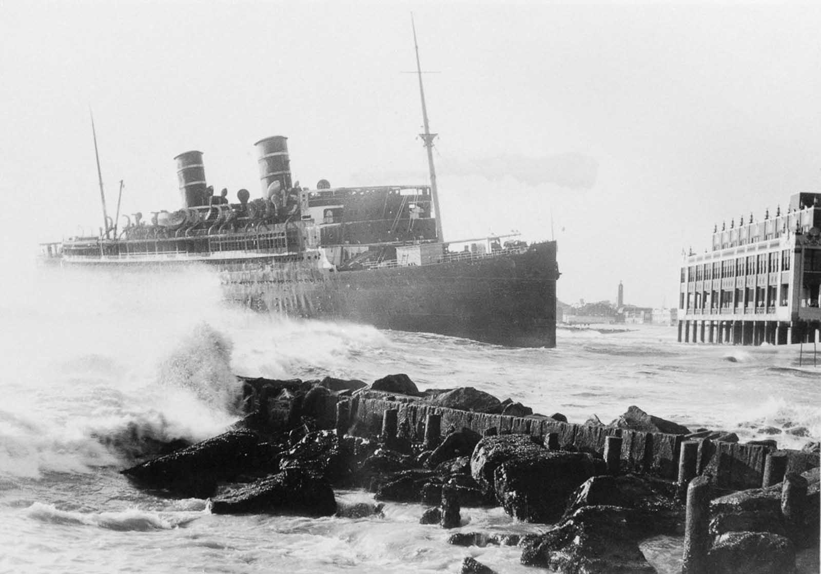 The wreck of the Morro Castle in the process of being pushed out to sea by salvage engineers.