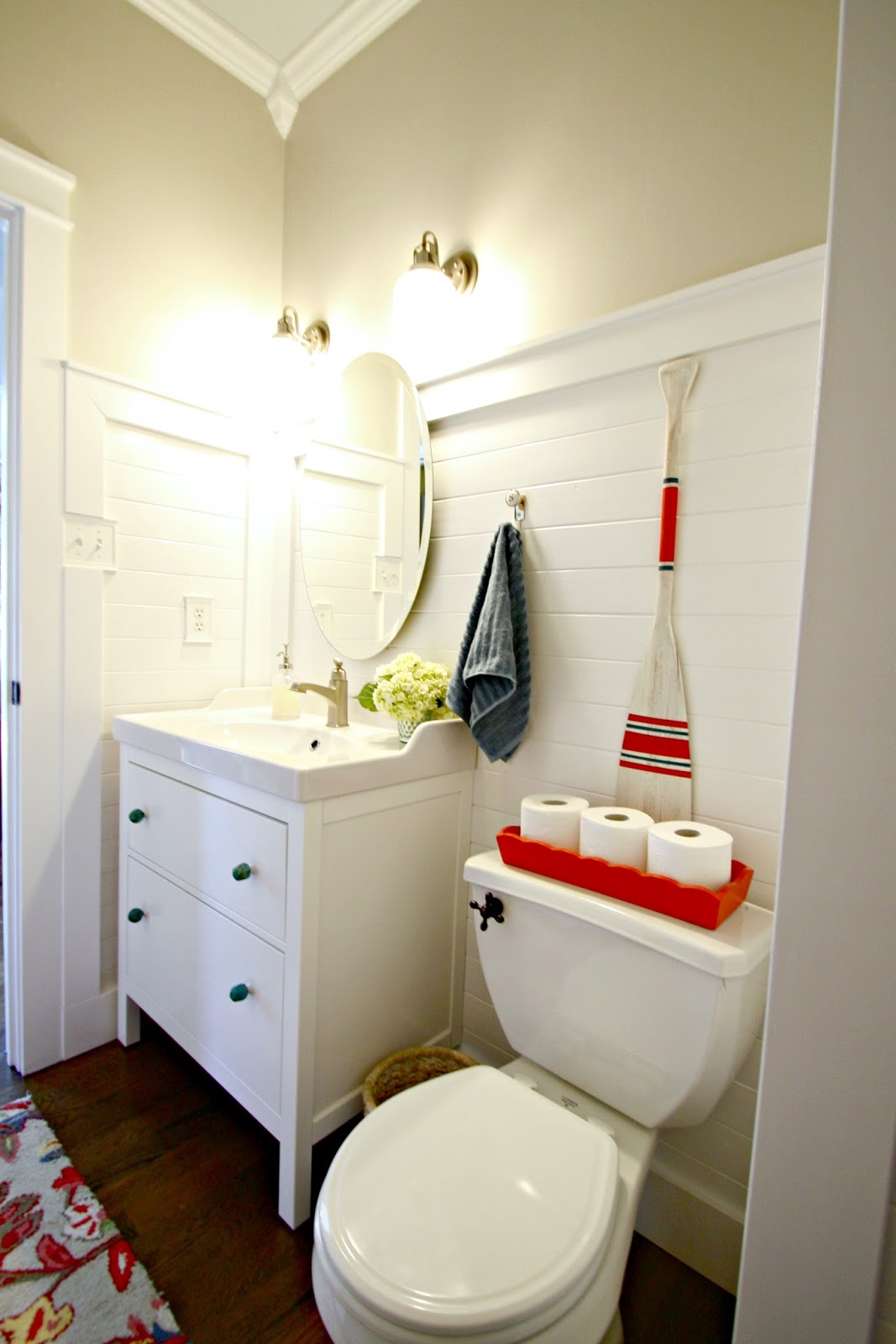 Bathroom with wood planked white walls