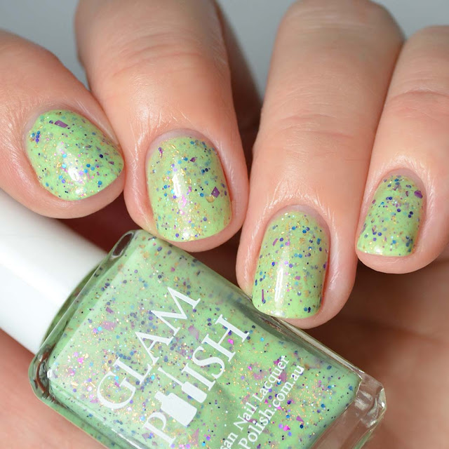 green nail polish with glitter swatch