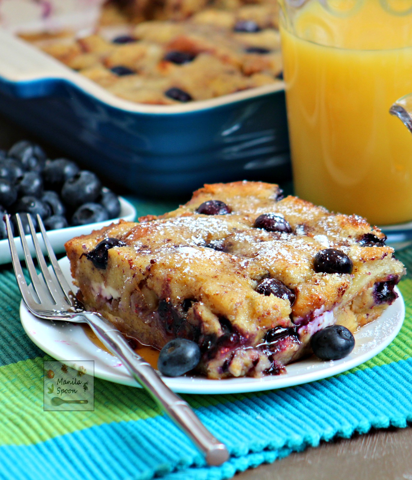 Juicy berries, crunchy walnuts plus yummy cream cheese and warmed up maple syrup make this a fantastic breakfast or brunch dish - Overnight Blueberry French Toast Casserole | manilaspoon.com