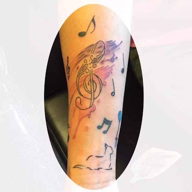 Music Notes With Nice Guitar Tattoo On Forearm Tattooshunt Com