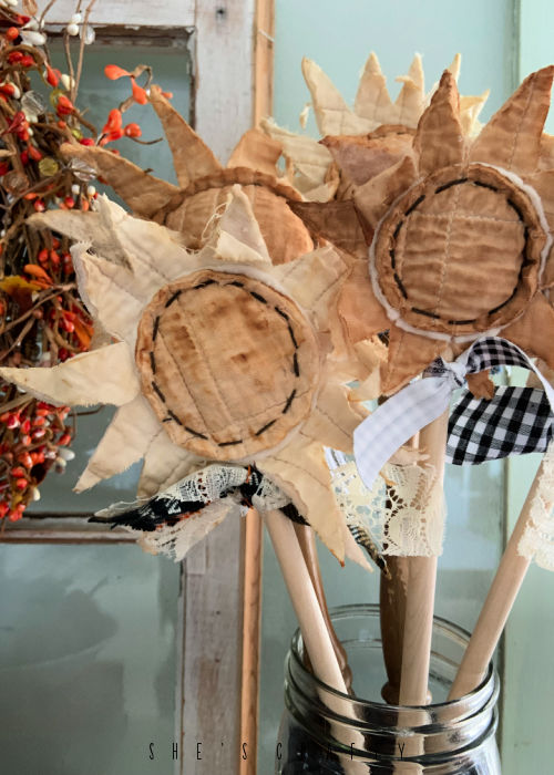 Rustic and Primitive Sunflowers made from fabric in a jar.