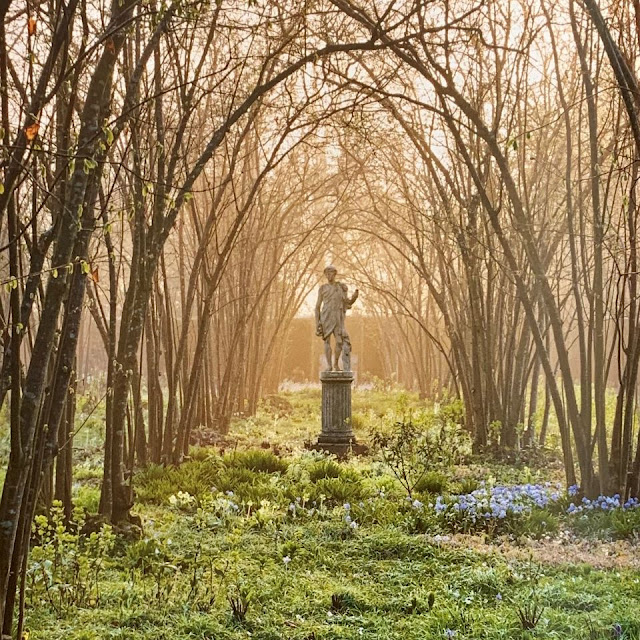 Statue in tree grove of Sissinghurst