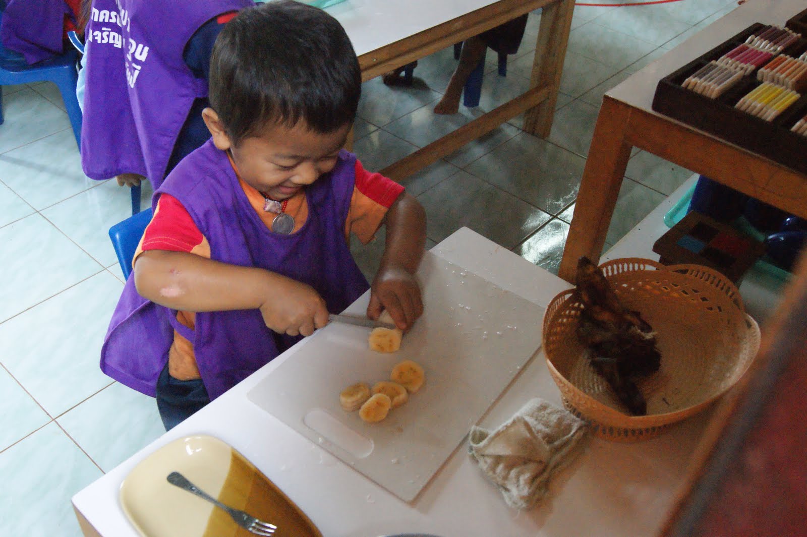 khom-loy-montessori-food-preparation-banana-cutting-care-of-person