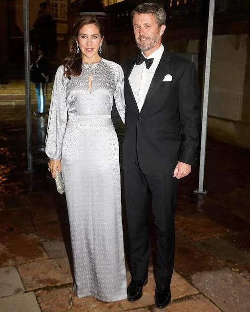 Crown Princess Mary wore a faye silver silk gown by Temperley London. Furmani stone flap silver clutch, Gianvito Rossi Fumo Grey suede pumps