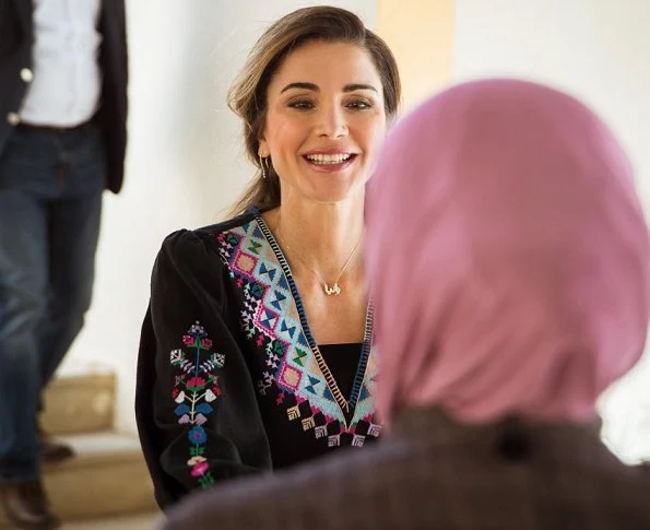 Queen Rania announced of financial support for families. Queen wears Victoria Beckham blouse from Spring/Summer 2018 Fashion collection