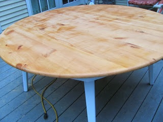 knotty pine table being refinished