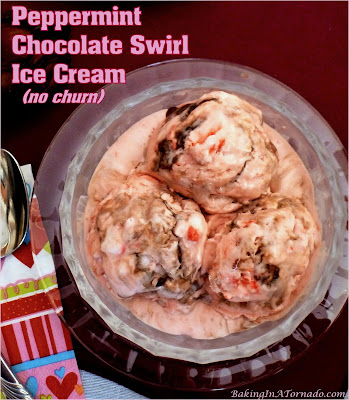 Peppermint Chocolate Swirl Ice Cream, NO CHURN, studded with peppermint candy pieces and swirled with chocolate syrup. | Recipe developed by www.BakingInATornado.com | #recipe #ValentinesDay