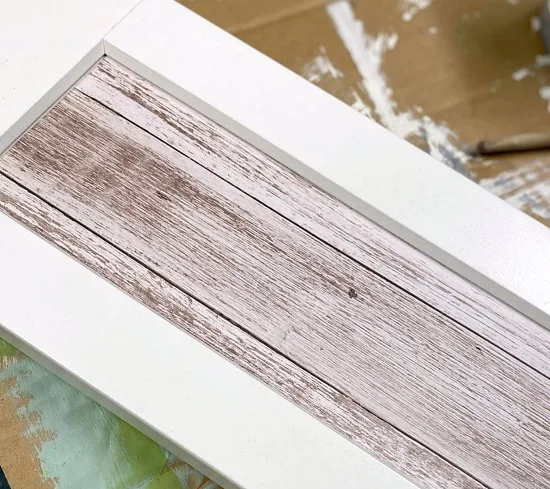 Woodgrain paper in recess of cabinet door