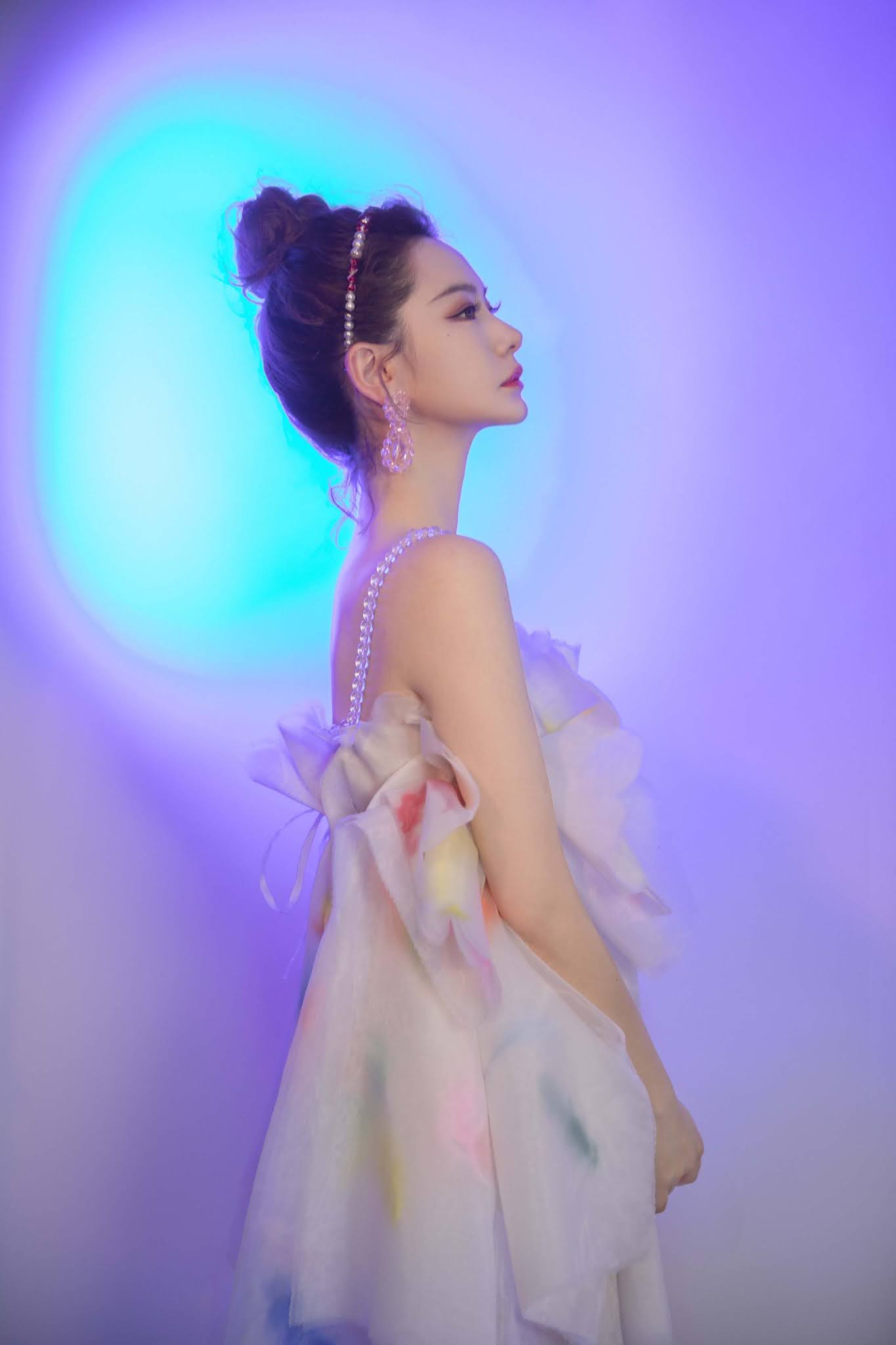 , Qi Wei poses for photo shoot