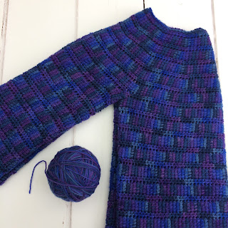 Ball of yarn and crochet sweater