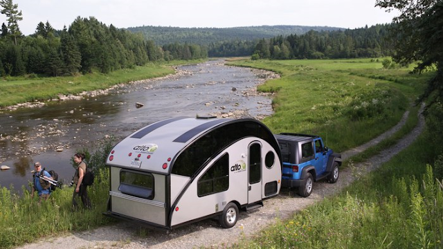 Compact teardrop trailer transforms into a large family camper.