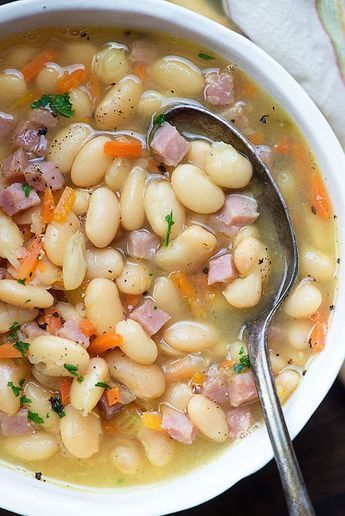 White Bean and Ham Soup Recipe - This white bean and ham soup recipe is a great way to use up that leftover ham! You'll start with dried beans, onions, celery, and carrots. The beans and ham cook until nice and tender. #whitebeanandhamsouprecipe #soup