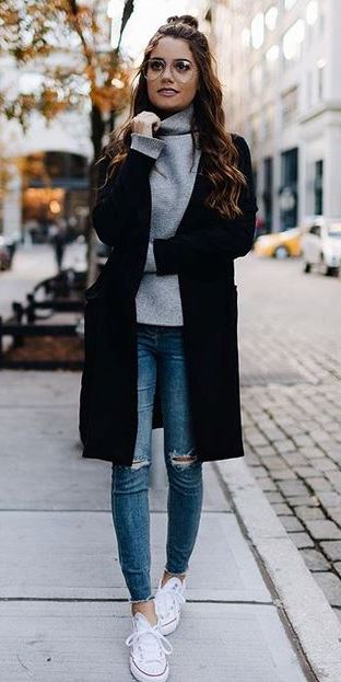 trendy outfit idea : black coat + sweater + rips + sneakers