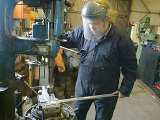 Owen drilling a replacement damper door handle for Twizell