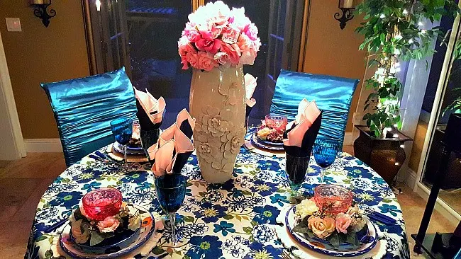 Boho chic tablescape with blues, greens and pink. Created at LifeandLinda.com