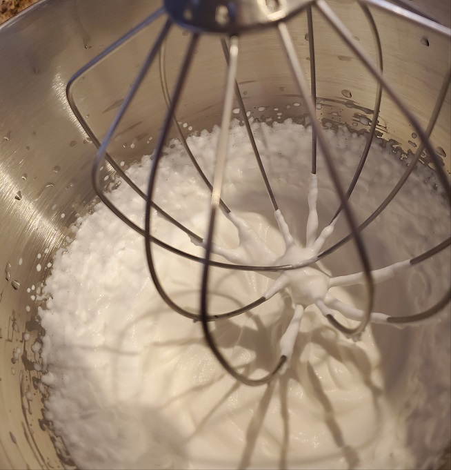 this is a kitchenaid mixer with egg whites made into meringue with the whip beater