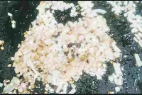 Frying chopped onion with ginger garlic paste for chicken lababdar recipe