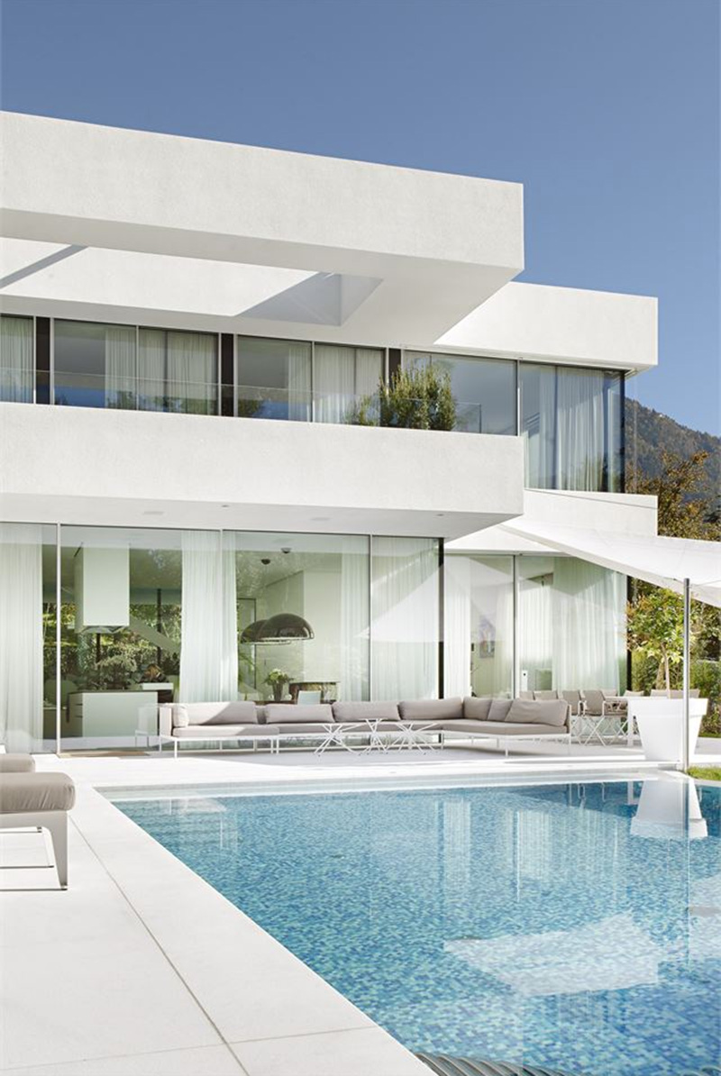 white modern house and swimming pool.