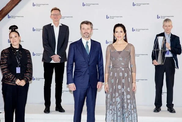 Crown Princess Mary wore a new bespoke silk chiffon and metallic embroidery dress from Soeren Le Schmidt, and aquamarine girandole earrings