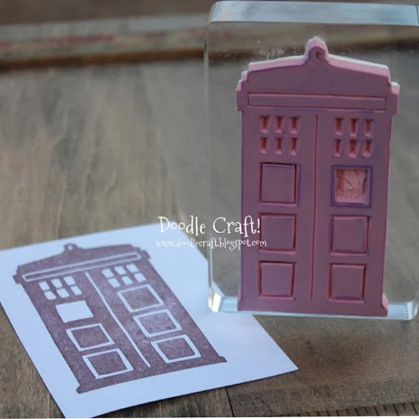 Tardis from doctor who carved out of red rubber to make a stamp.