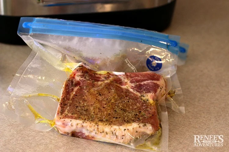 Pork chops in vacuum bag and ready for sous vide machine.