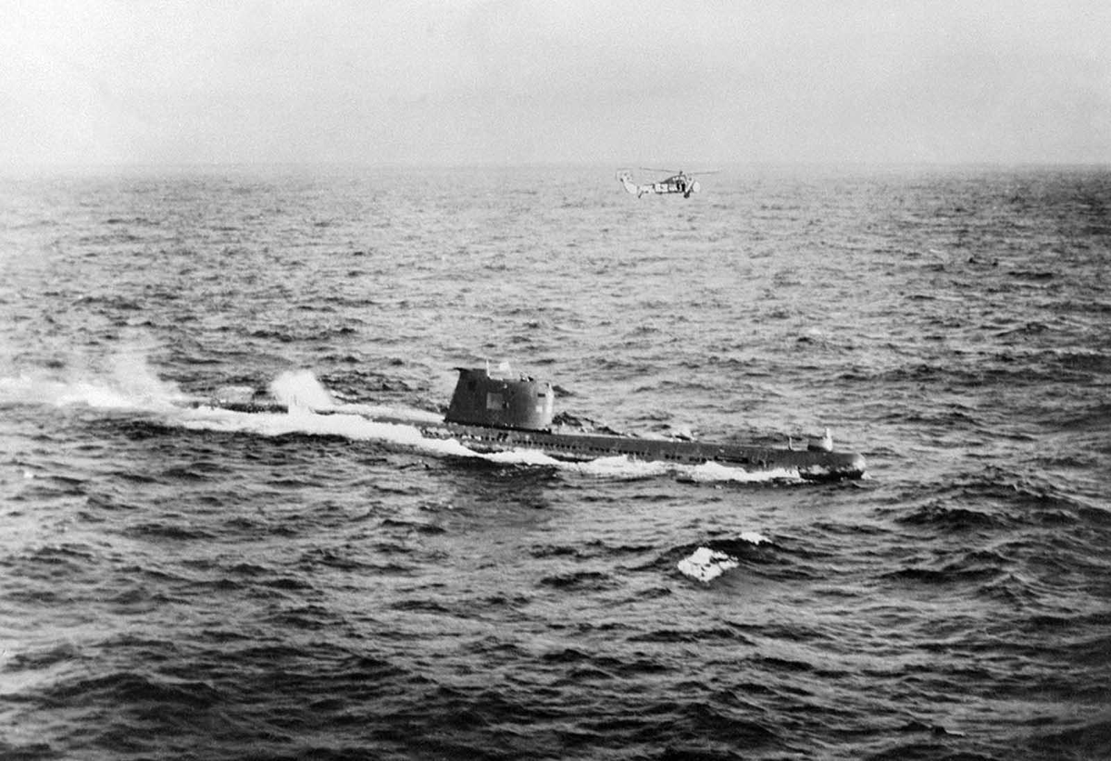 A Soviet submarine near the Cuban coast controlling the operations of withdrawal of the Russian Missiles from Cuba in accordance with the US-Soviet agreement, on November 10, 1962. American planes and helicopters flew at a low level to keep close check on the dismantling and loading operations, while US warships watched over Soviet freighters carrying missiles back to Soviet Union. 