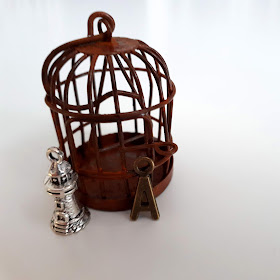1/12 scale miniature aged birdcage with lighthouse and letter A charms.