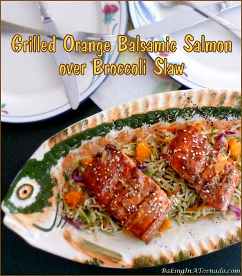 Grilled Orange Balsamic Salmon over Broccoli Slaw, a fast and easy dinner. Salmon is marinated, grilled, and served over a broccoli slaw dressed with the same marinade. | Recipe developed by www.BakingInATornado.com | #recipe #dinner