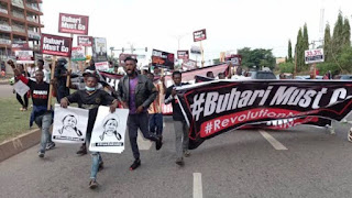 BREAKING: ‘Buhari Must Go’ Protesters Set Bonfires On Abuja Airport Road BREAKING: ‘Buhari Must Go’ Protesters Set Bonfires On Abuja Airport Road