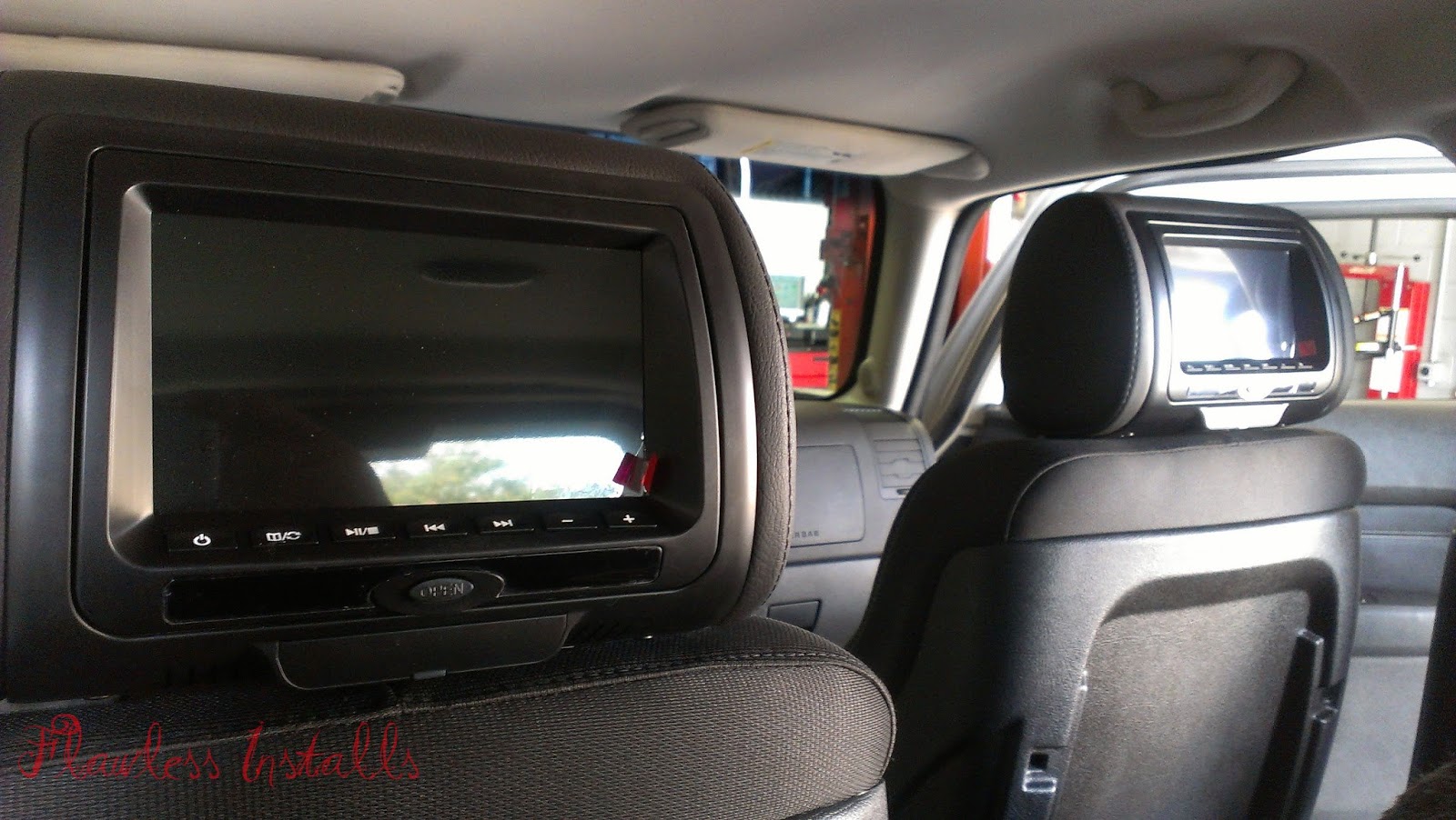 FlawlessAutosoundAndSecurity Hummer H3 JVC head unit & headrest monitors