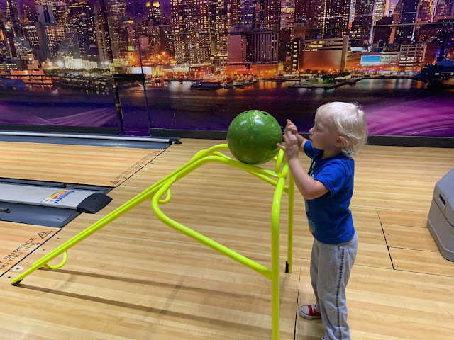 3 year old with a bowling ramp at Rollerbowl