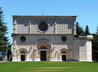 The Basilica di Santa Maria di Collemaggio,  with its distinctive pink and white facade