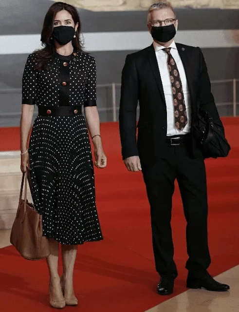 Crown Princess Mary wore a new polka dot pleated dress from Prada. French President Emmanuel Macron