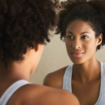 Black woman smiling in mirror- marydeescott-blogspot-com