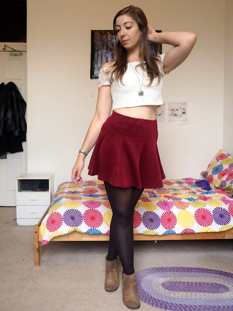 Disneybound outfit inspired by Jane Porter from Tarzan, of white lace crop top, burgundy red skater skirt, and brown suede ankle boots